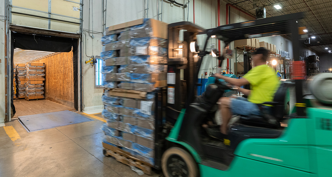 forklift at warehouse dock door