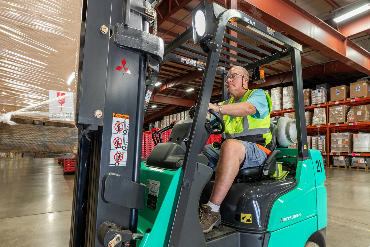 forklift driver in safety vest